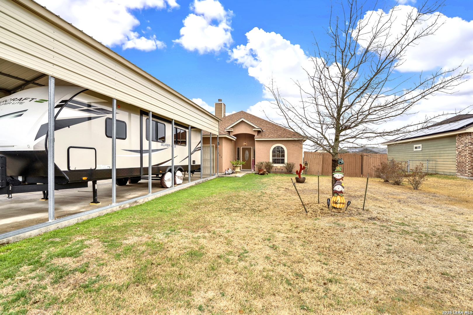 11669 Flores Avenue LaCoste, TX 78039 - Photo 3 of 36 a view of a house with a yard