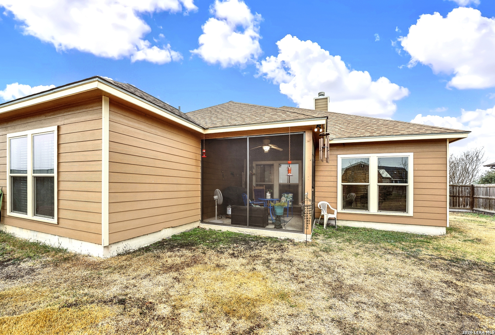 11669 Flores Avenue LaCoste, TX 78039 - Photo 5 of 36 front view of a house with a yard