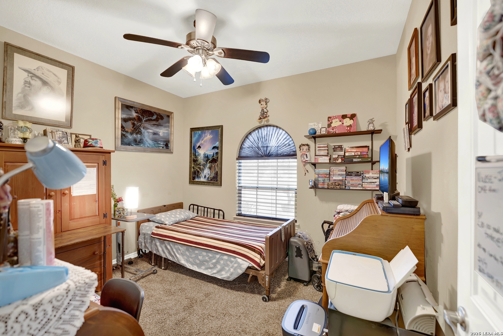 11669 Flores Avenue LaCoste, TX 78039 - Photo 9 of 36 a bedroom with a bed and wooden floor