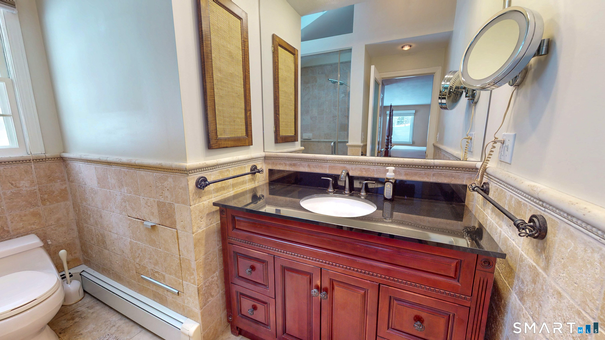 197 Foote Road Glastonbury, CT 06073 - Photo 1 of 1 a bathroom with a granite countertop sink and a mirror