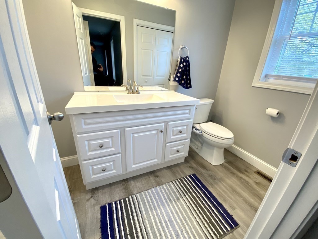 8 Mill Street, Unit B Wareham, MA 02576 - Photo 13 of 30 a bathroom with a sink and a mirror