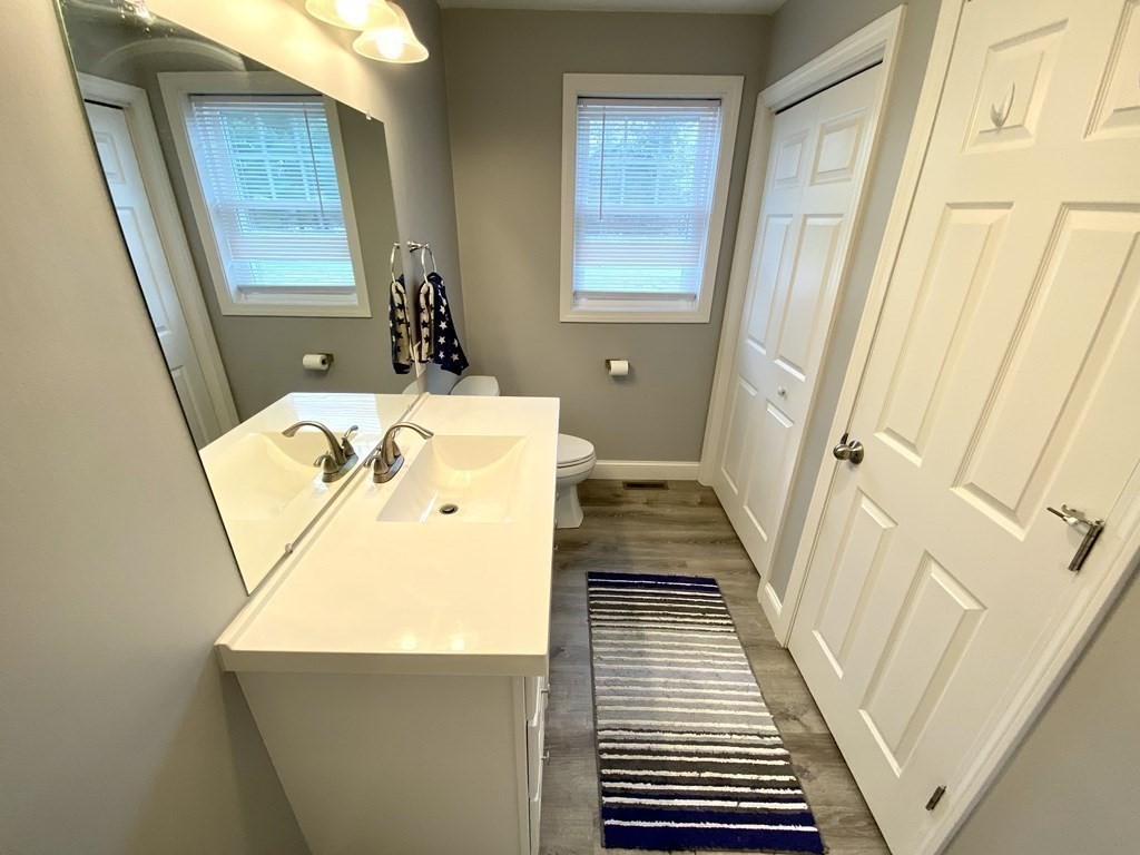 8 Mill Street, Unit B Wareham, MA 02576 - Photo 14 of 30 a bathroom with a sink and a mirror