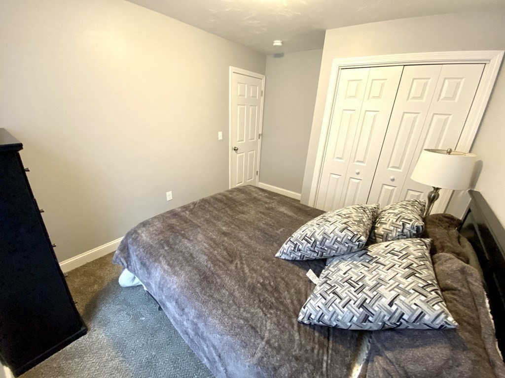 8 Mill Street, Unit B Wareham, MA 02576 - Photo 16 of 30 a bedroom with a bed and a window