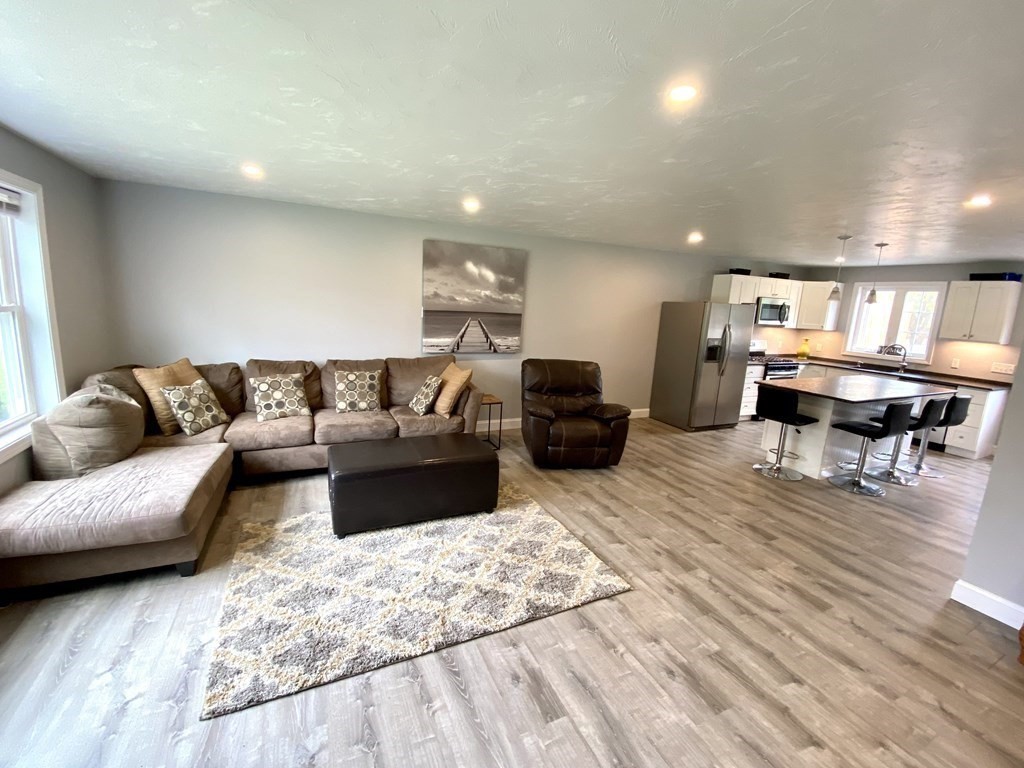 8 Mill Street, Unit B Wareham, MA 02576 - Photo 2 of 30 a living room with furniture and a piano