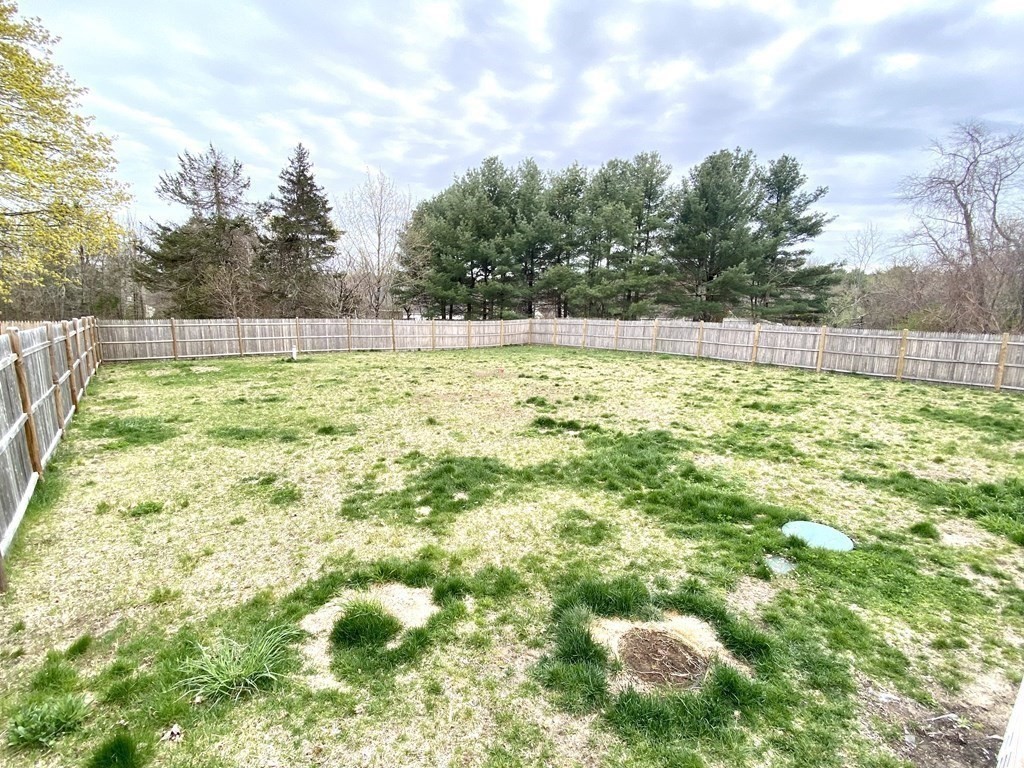 8 Mill Street, Unit B Wareham, MA 02576 - Photo 24 of 30 a view of yard with swimming pool and trees in the background