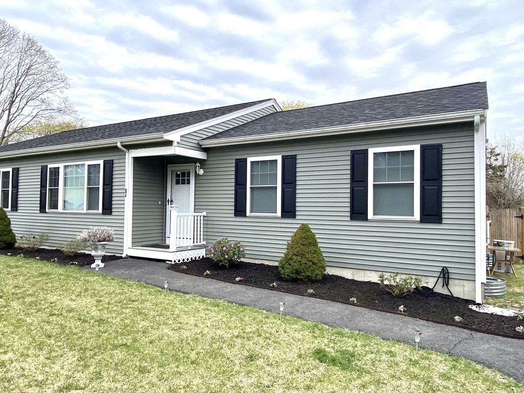 8 Mill Street, Unit B Wareham, MA 02576 - Photo 29 of 30 a front view of a house with a yard