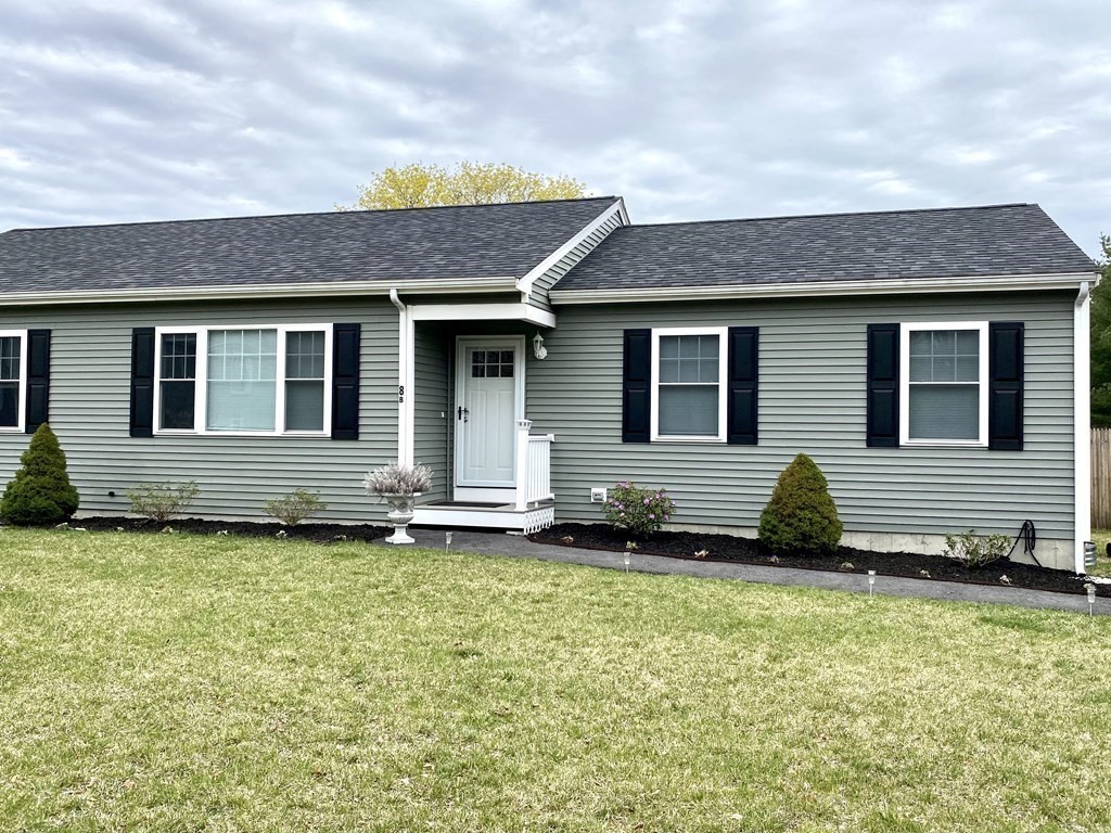 8 Mill Street, Unit B Wareham, MA 02576 - Photo 30 of 30 a backyard of a house with lots of green space