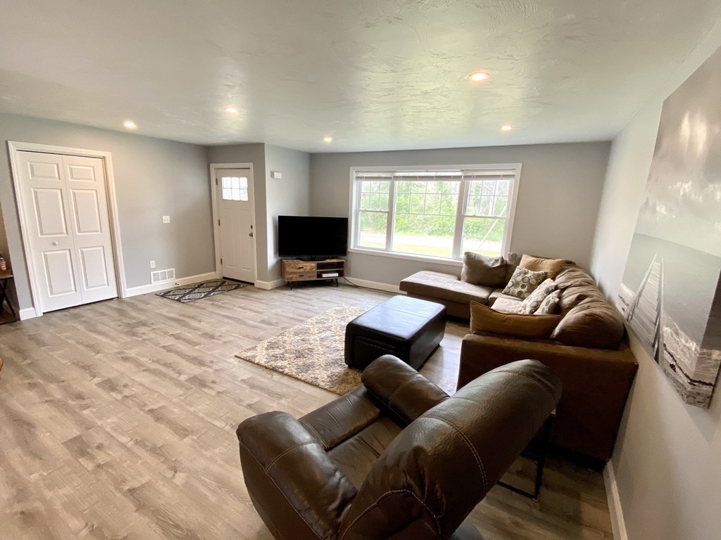 8 Mill Street, Unit B Wareham, MA 02576 - Photo 4 of 30 a living room with furniture window and a flat screen tv