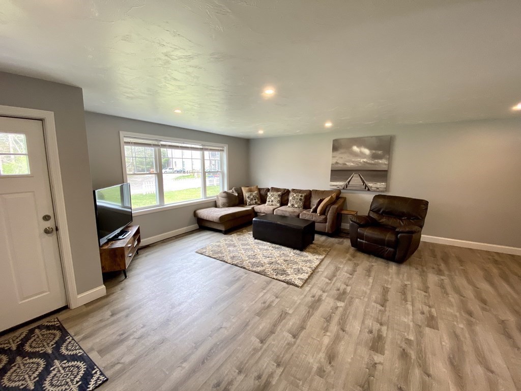 8 Mill Street, Unit B Wareham, MA 02576 - Photo 6 of 30 a living room with furniture and a wooden floor
