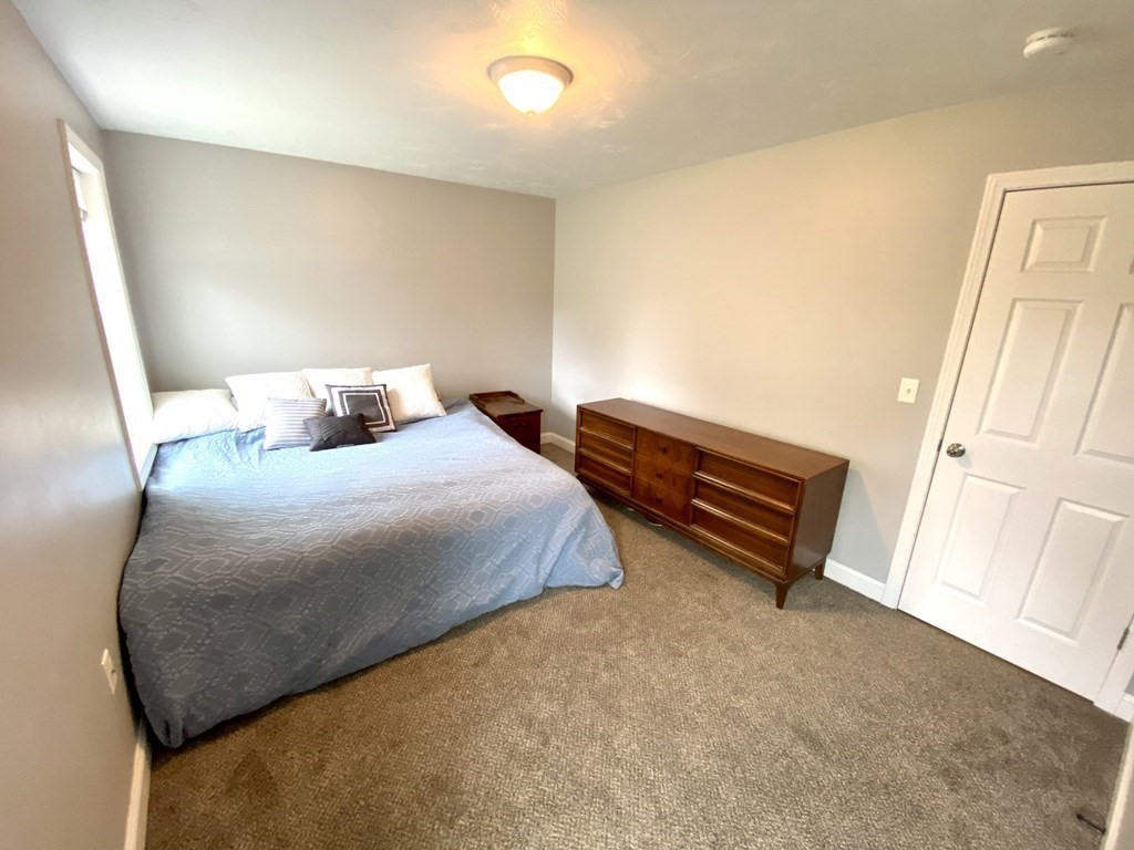 8 Mill Street, Unit B Wareham, MA 02576 - Photo 10 of 30 a bedroom with a bed and a window