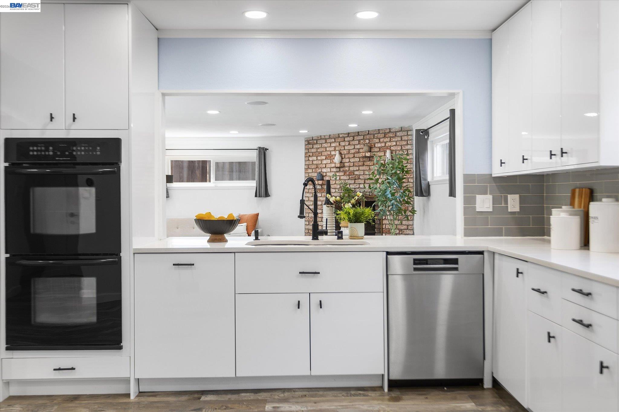 16683 Kildare Road Castro Valley, CA 94546 - Photo 24 of 77 a kitchen with white cabinets and sink