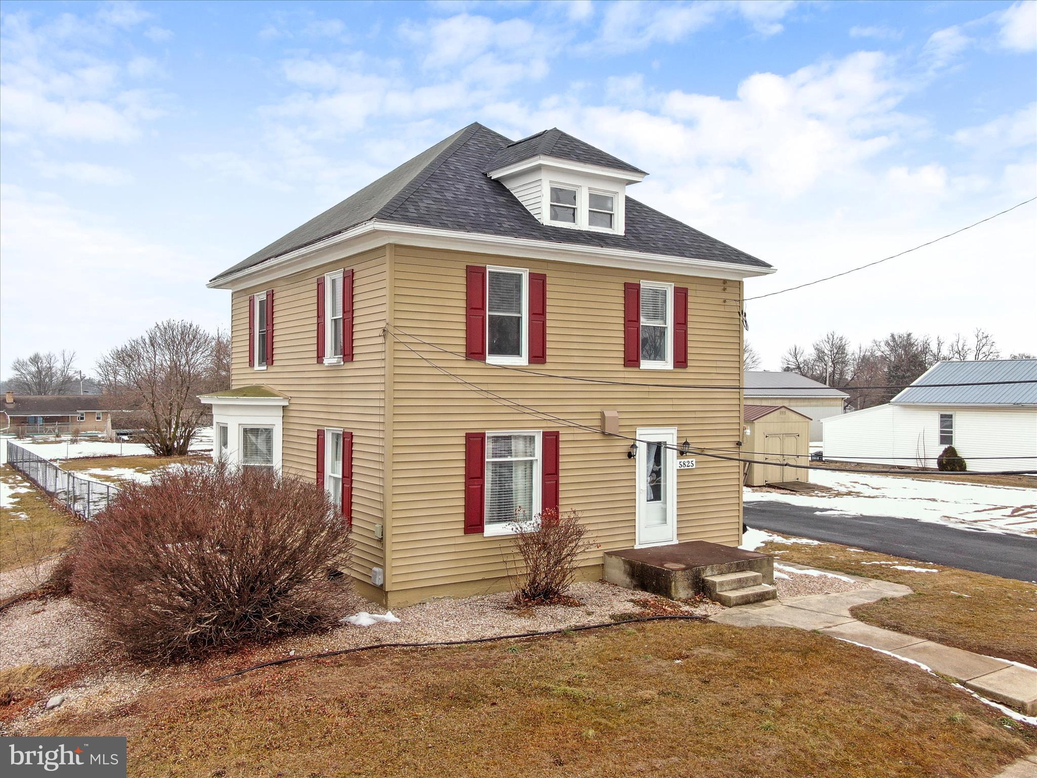 5825 Front Street Chambersburg, PA 17202 - Photo 2 of 37 a front view of a house with a yard