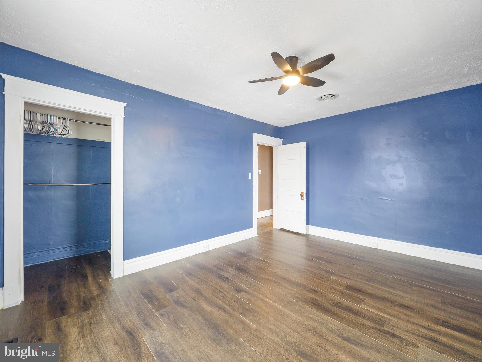 5825 Front Street Chambersburg, PA 17202 - Photo 23 of 37 a view of an empty room with window and wooden floor
