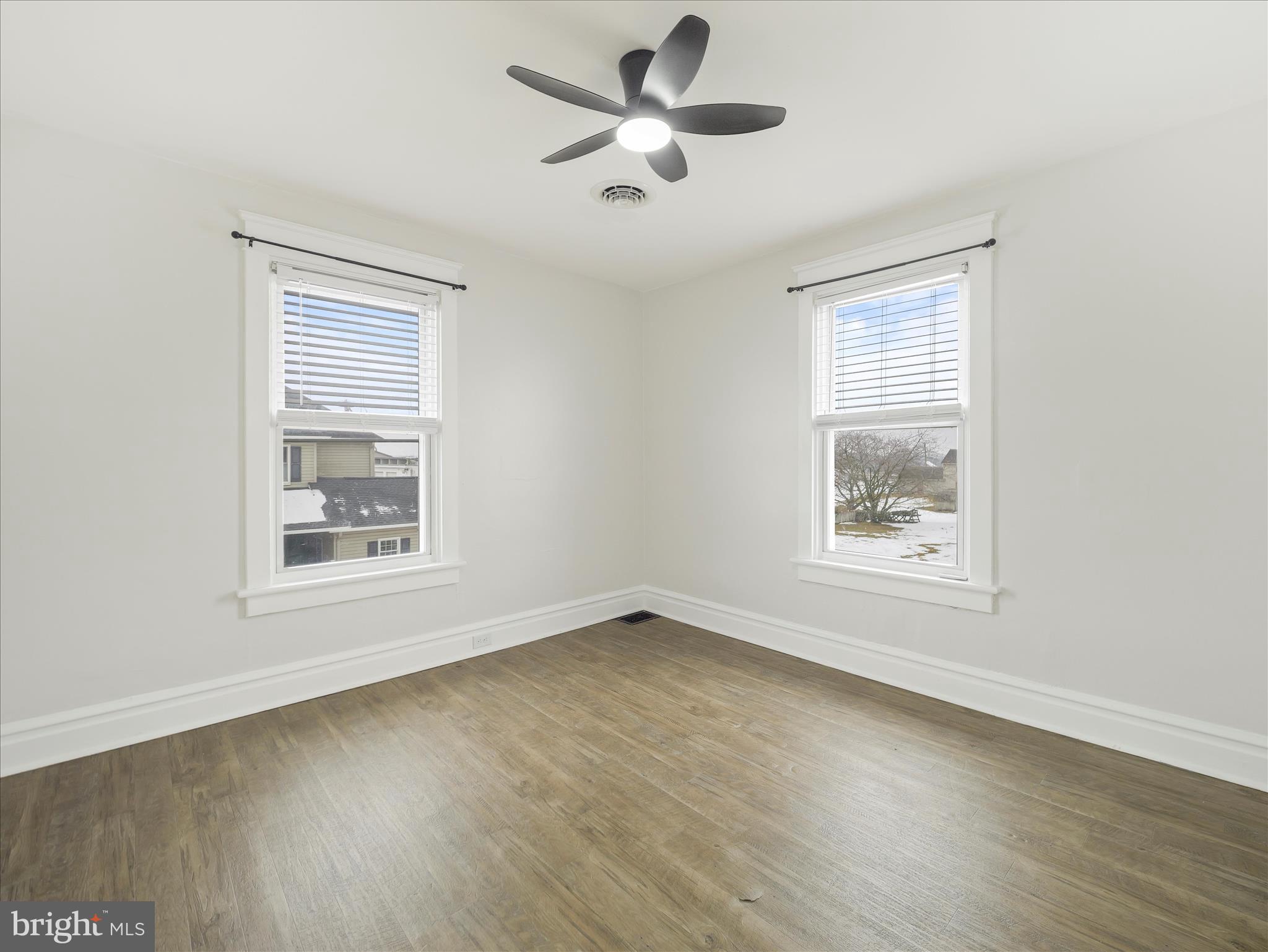 5825 Front Street Chambersburg, PA 17202 - Photo 24 of 37 a view of an empty room with wooden floor and a window