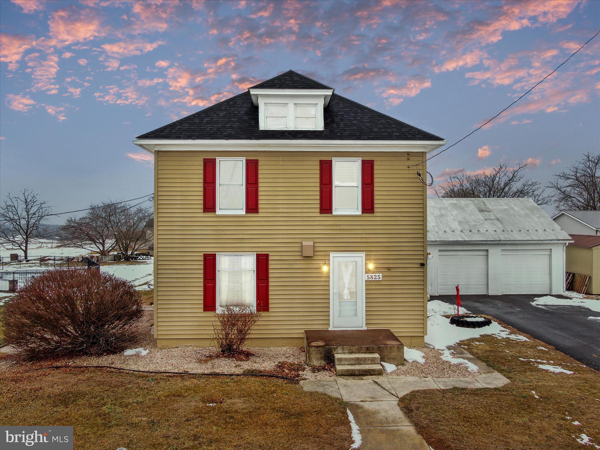 5825 Front Street Chambersburg, PA 17202 - Photo 3 of 37 a front view of a house with a yard