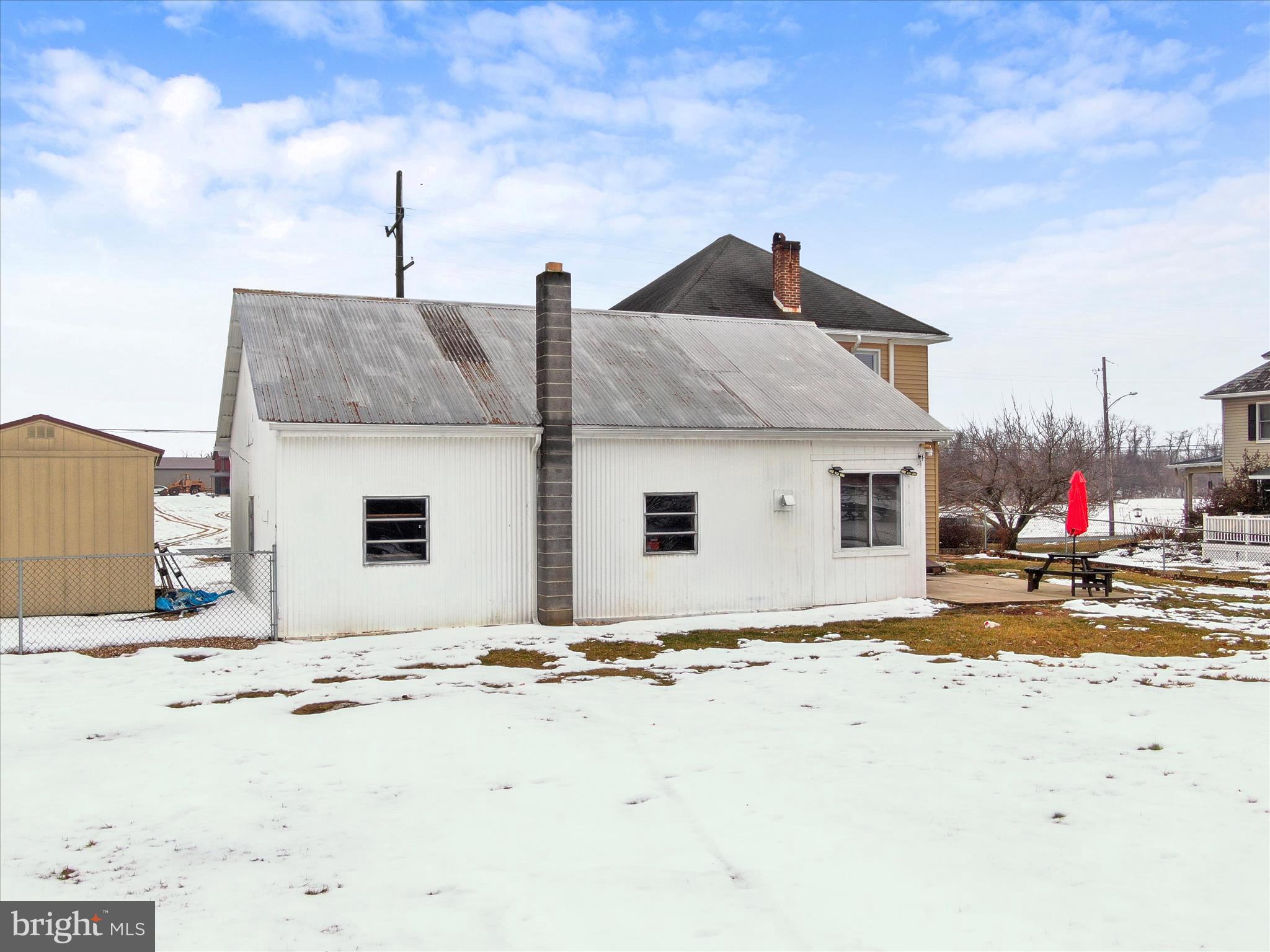 5825 Front Street Chambersburg, PA 17202 - Photo 35 of 37 a front view of a house with a yard