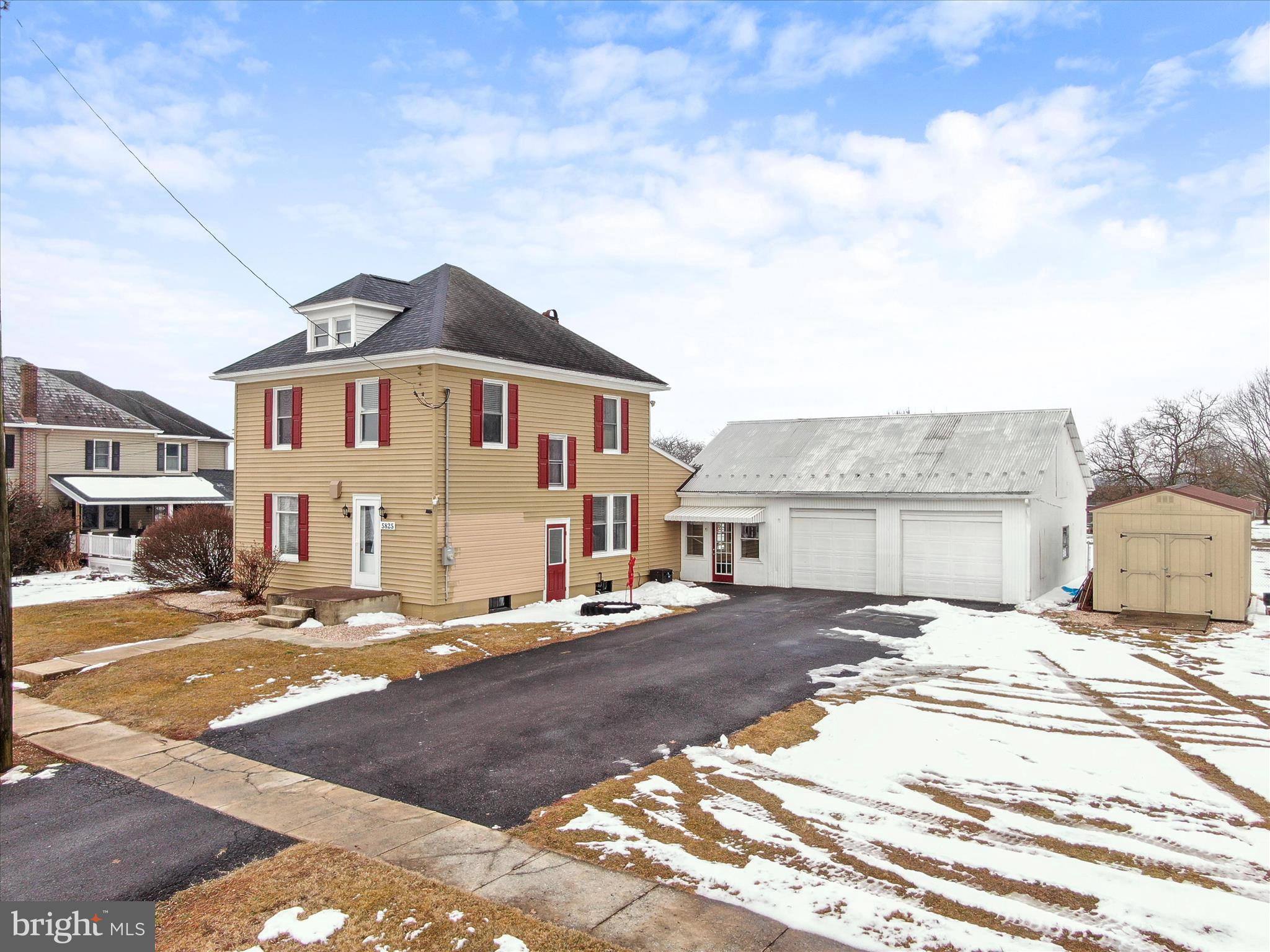 5825 Front Street Chambersburg, PA 17202 - Photo 4 of 37 a front view of a house with a patio