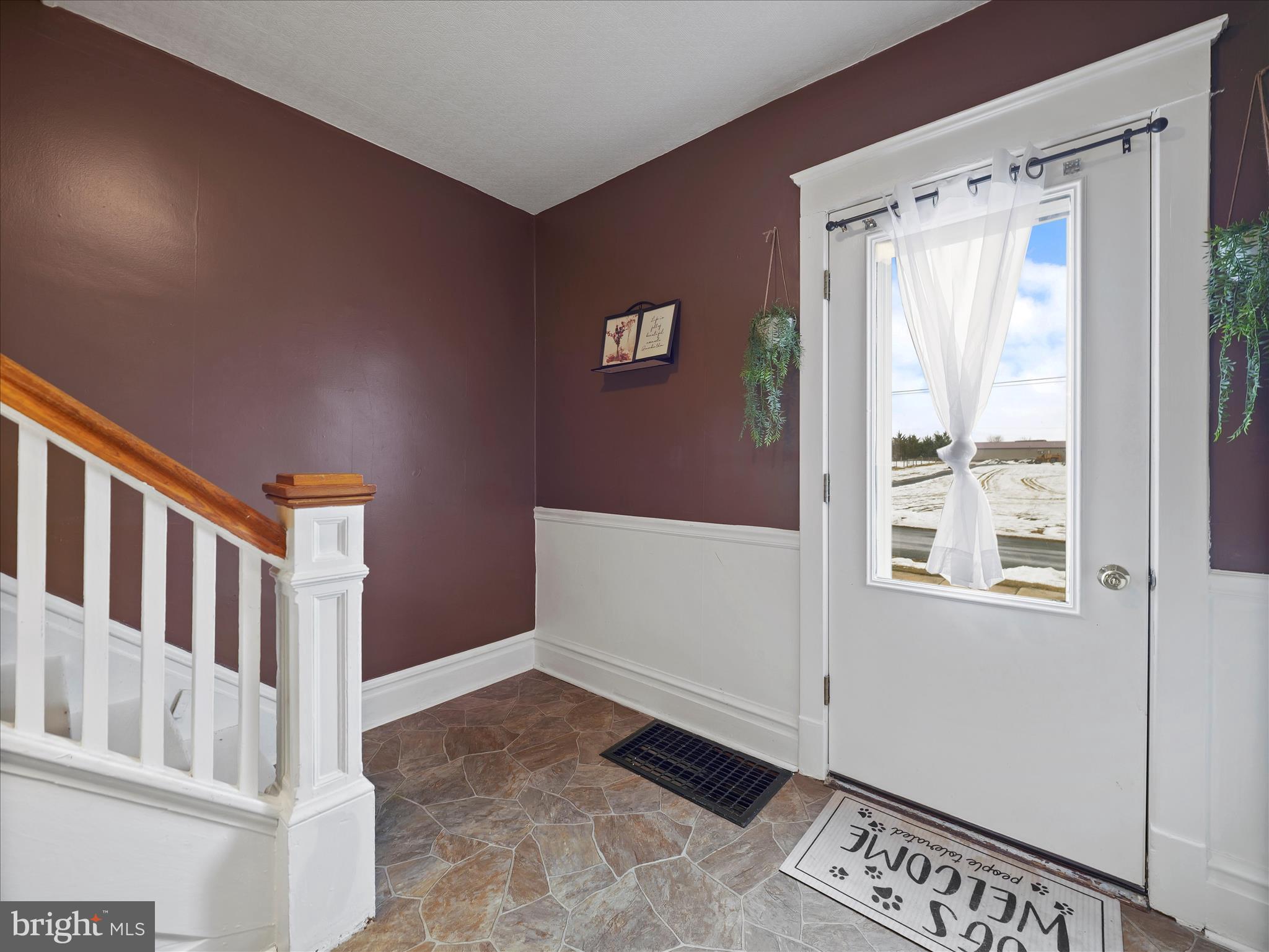 5825 Front Street Chambersburg, PA 17202 - Photo 5 of 37 a view of an entryway with wooden floor and cabinet