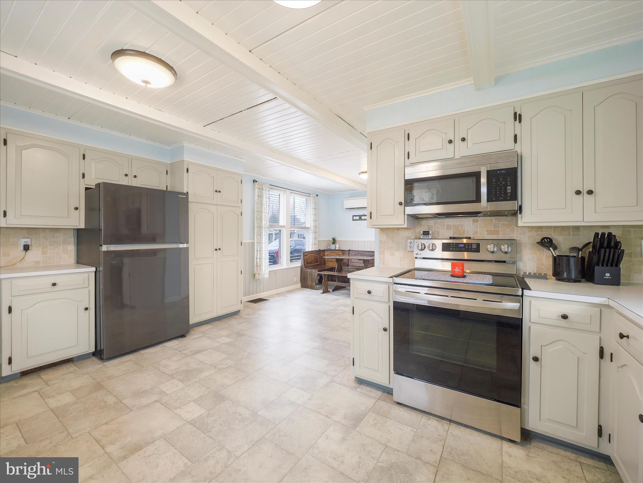 5825 Front Street Chambersburg, PA 17202 - Photo 8 of 37 a kitchen with stainless steel appliances granite countertop a stove a sink and a refrigerator
