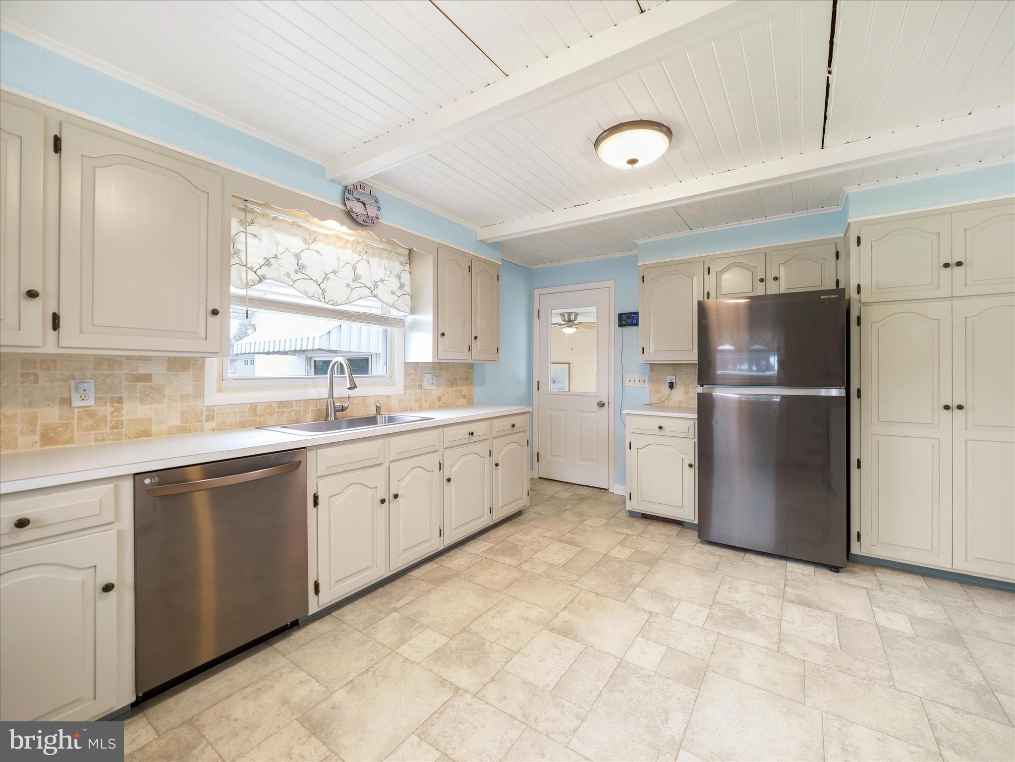 5825 Front Street Chambersburg, PA 17202 - Photo 9 of 37 a kitchen with a refrigerator sink and cabinets