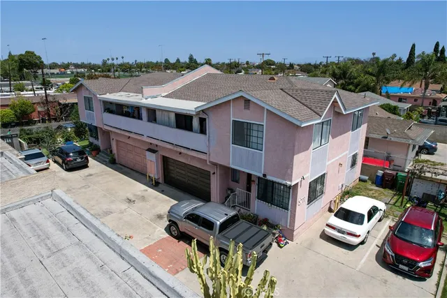 a aerial view of a house with a garden and balcony