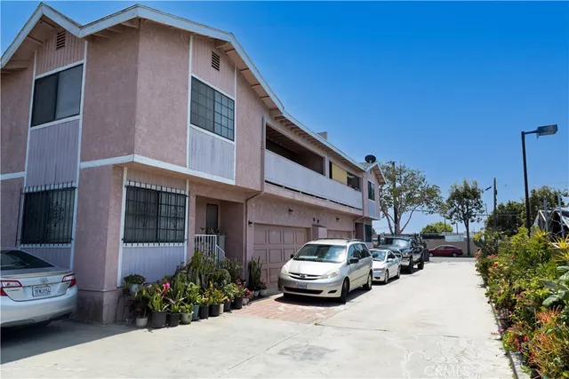 a car parked in front of a white building