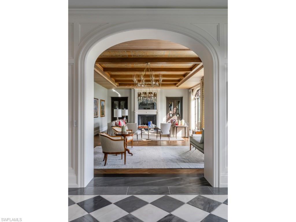 4296 Cutlass Lane Naples, FL 34102 - Photo 12 of 35 a view of living room with furniture and large windows