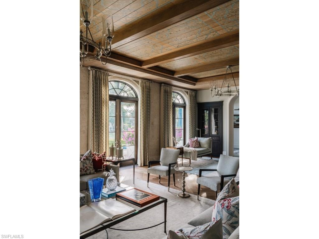 4296 Cutlass Lane Naples, FL 34102 - Photo 14 of 35 a living room with furniture and large windows