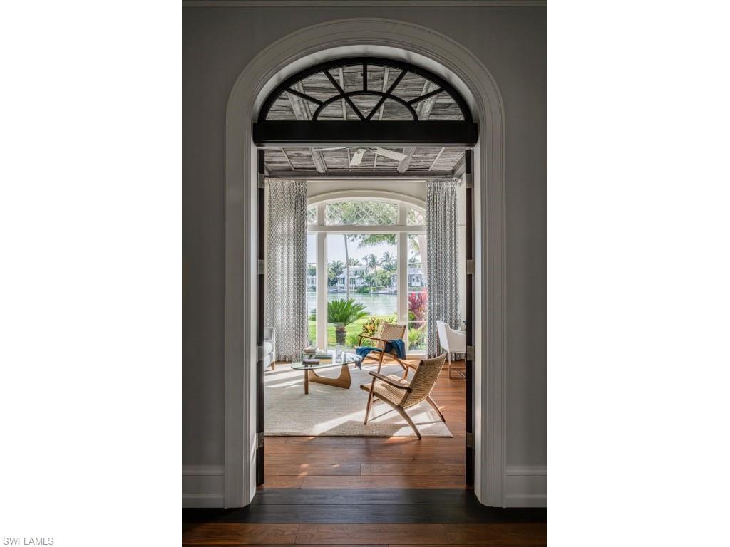 4296 Cutlass Lane Naples, FL 34102 - Photo 16 of 35 a living room with furniture and a window