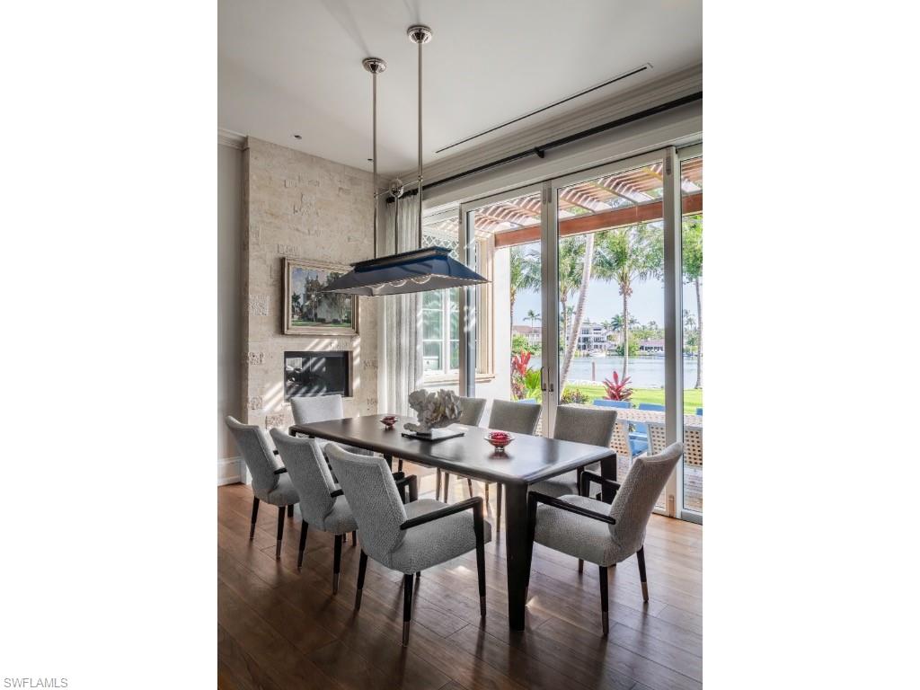 4296 Cutlass Lane Naples, FL 34102 - Photo 19 of 35 a view of a dining room with furniture window and outside view