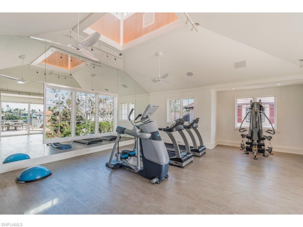 4296 Cutlass Lane Naples, FL 34102 - Photo 27 of 35 a view of a room with gym equipment