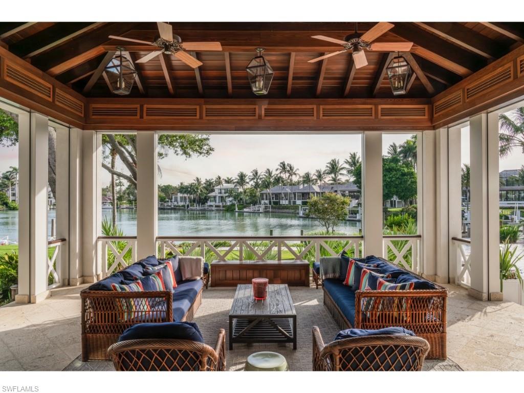 4296 Cutlass Lane Naples, FL 34102 - Photo 29 of 35 a view of swimming pool with outdoor seating