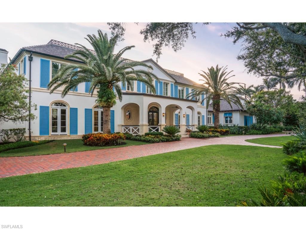 4296 Cutlass Lane Naples, FL 34102 - Photo 3 of 35 a front view of a house with yard and green space