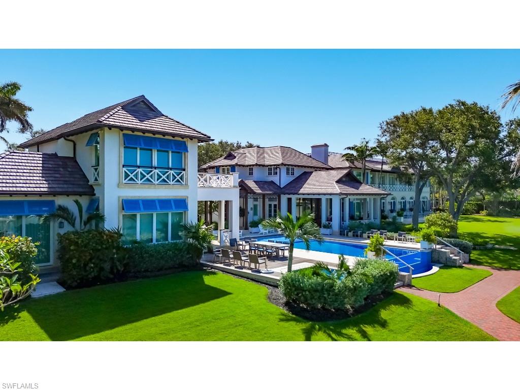 4296 Cutlass Lane Naples, FL 34102 - Photo 31 of 35 a view of a house with a yard