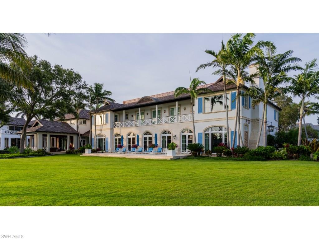 4296 Cutlass Lane Naples, FL 34102 - Photo 34 of 35 a front view of house with yard and green space