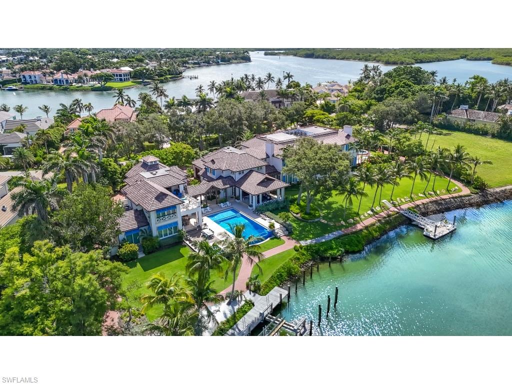 4296 Cutlass Lane Naples, FL 34102 - Photo 5 of 35 a picture of houses with outdoor space and lake view