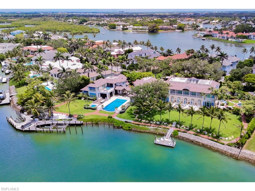4296 Cutlass Lane Naples, FL 34102 - Photo 6 of 35 an aerial view of residential house with outdoor space and lake view