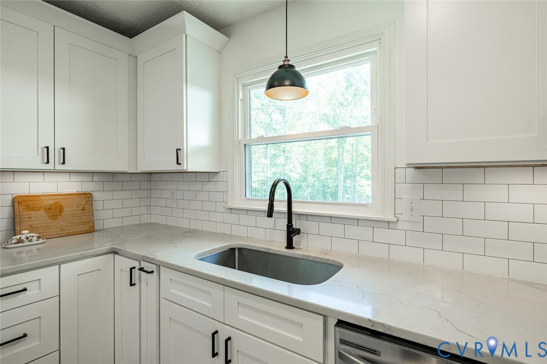 12397 New Market Mill Road Beaverdam, VA 23015 - Photo 8 of 44 a kitchen with a sink and cabinets