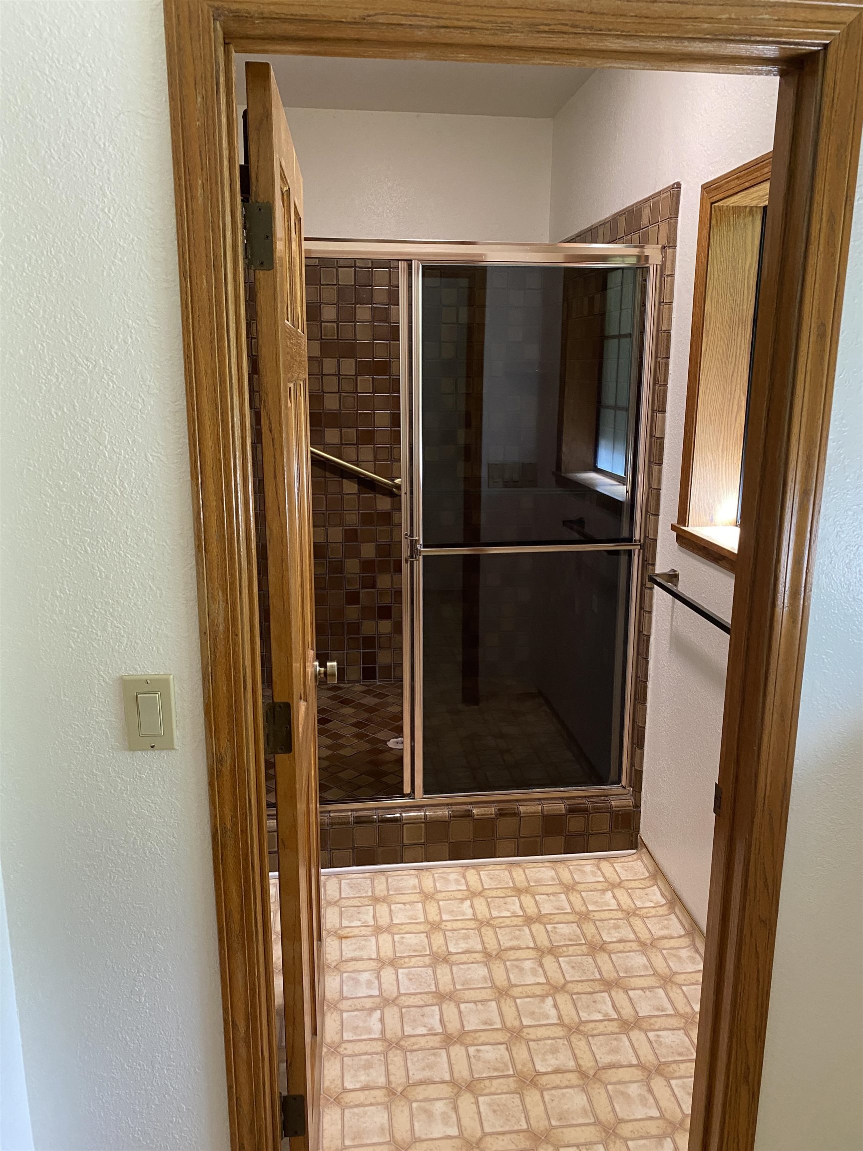 11 Foothill Lane Pleasanton, CA 94588 - Photo 16 of 38 a bathroom with a glass shower door