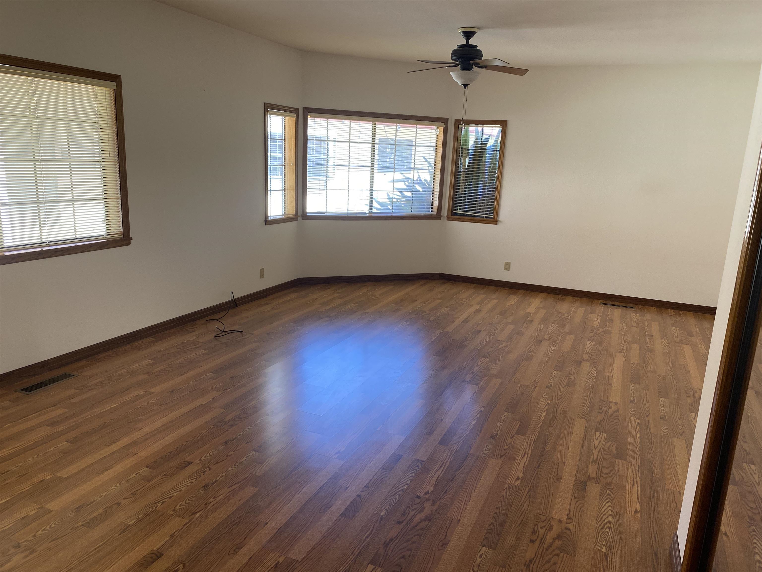 11 Foothill Lane Pleasanton, CA 94588 - Photo 18 of 38 a view of an empty room with wooden floor and a window