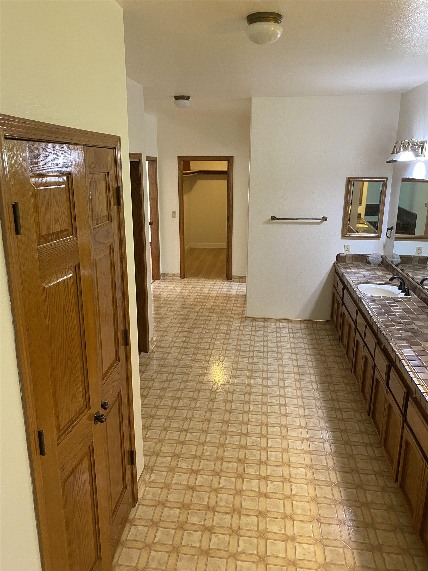 11 Foothill Lane Pleasanton, CA 94588 - Photo 2 of 38 a bathroom with a sink a toilet and mirror