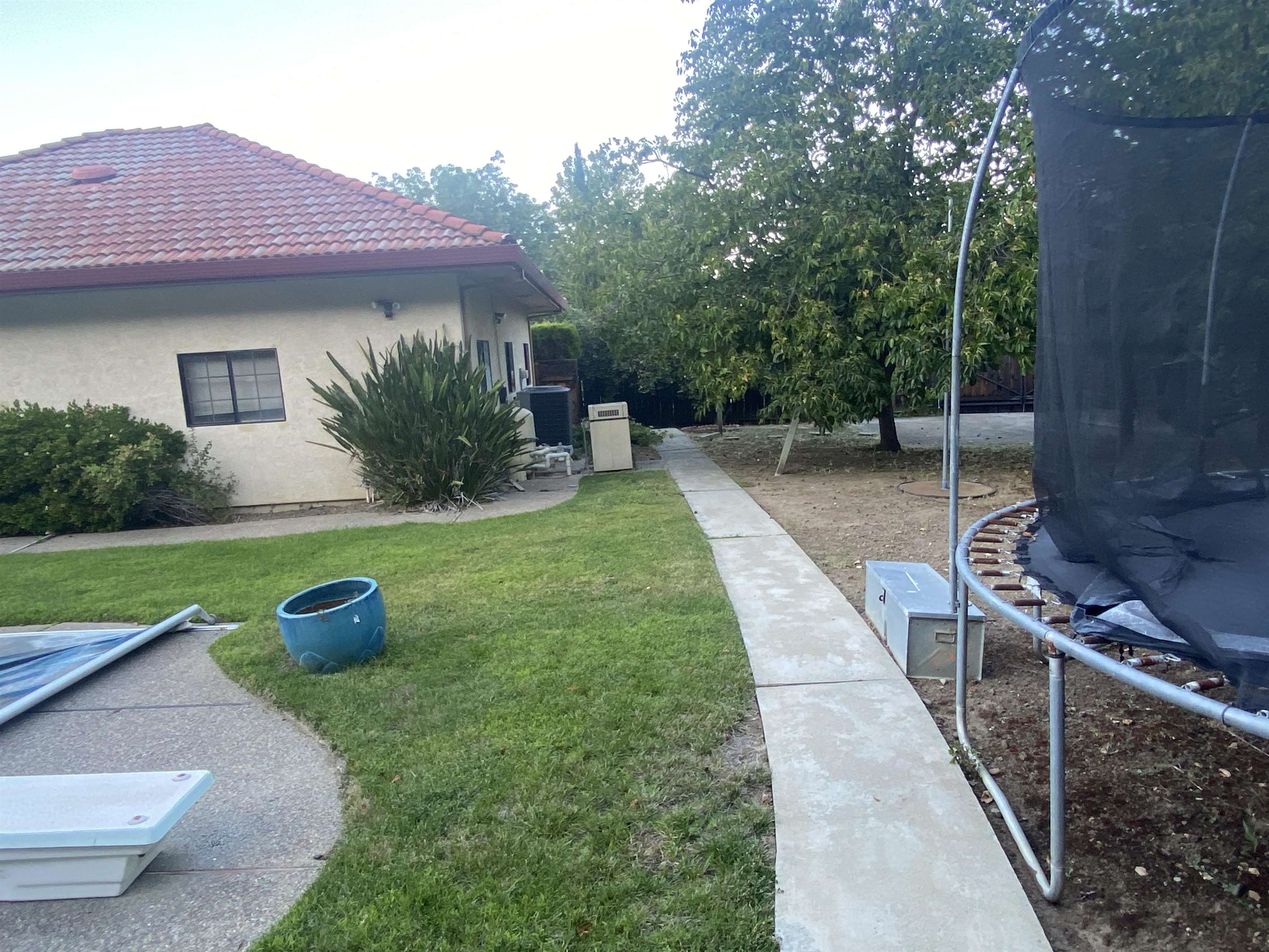 11 Foothill Lane Pleasanton, CA 94588 - Photo 27 of 38 a backyard of a house with seating space