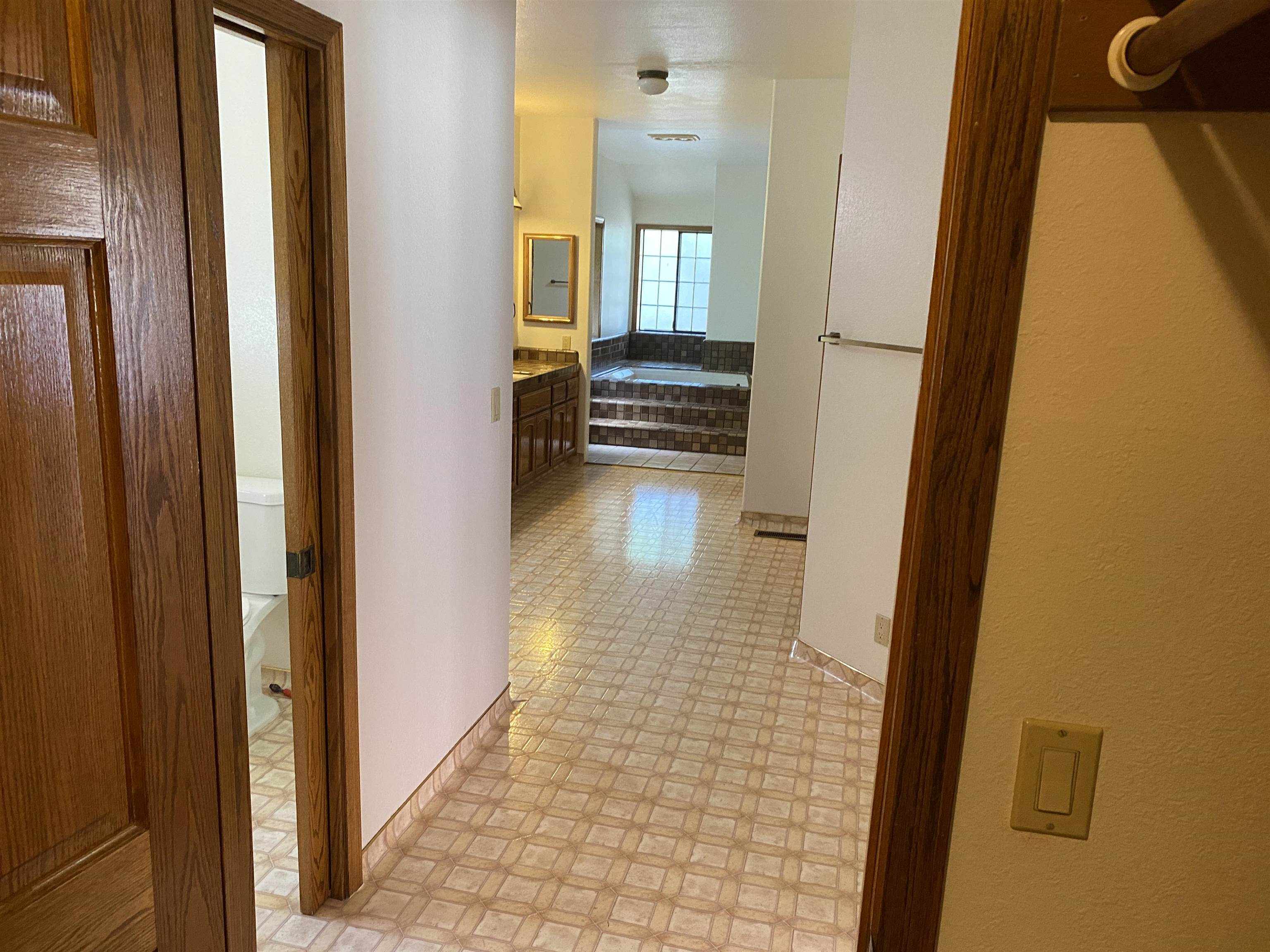 11 Foothill Lane Pleasanton, CA 94588 - Photo 4 of 38 a view of a hallway with wooden floor and a living room