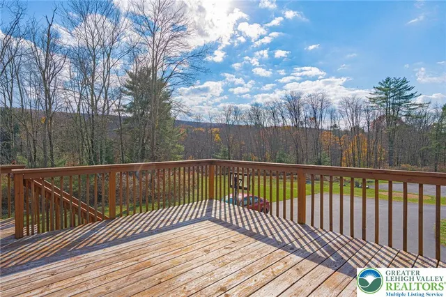 a view of balcony with wooden floor