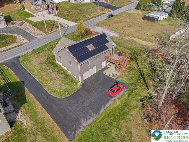 an aerial view of a house with swimming pool