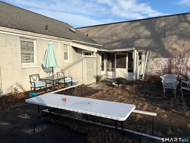a view of house with wooden deck