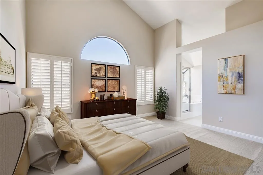 5034 Frazee Road Oceanside, CA 92057 - Photo 5 of 25 a bedroom with a bed mirror and window