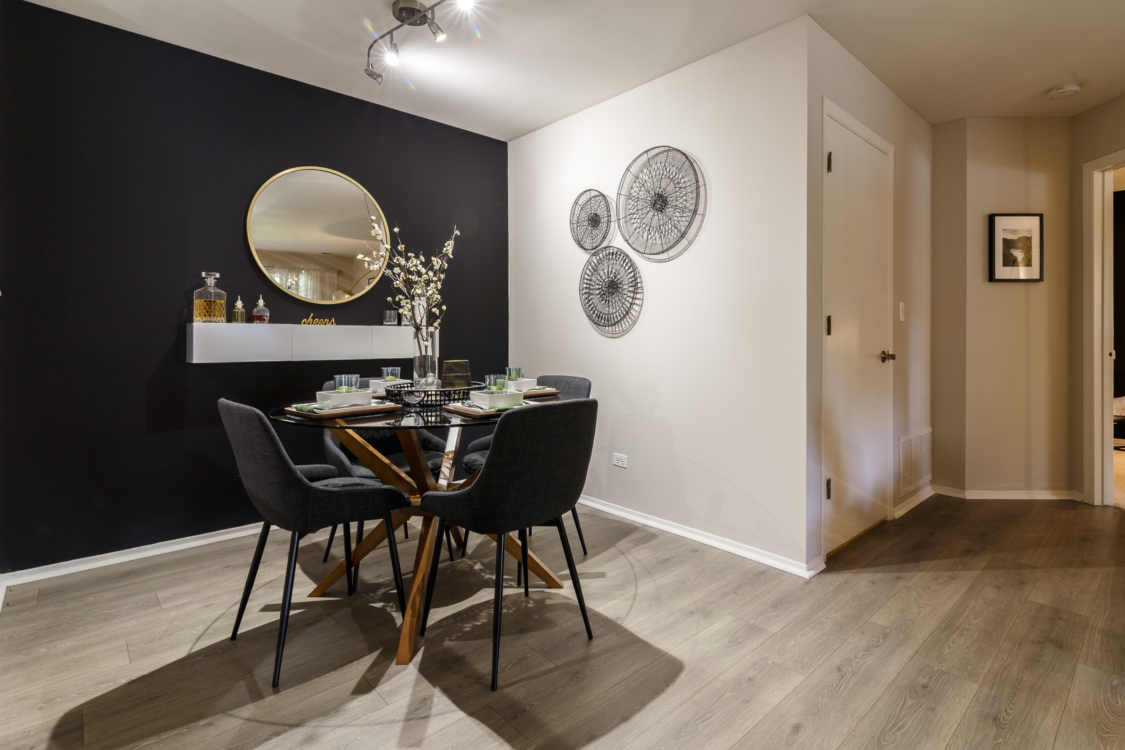 1681 East Greenbriar Drive, Unit 3818 Schaumburg, IL 60173 - Photo 6 of 26 a view of a dining room with furniture and wooden floor
