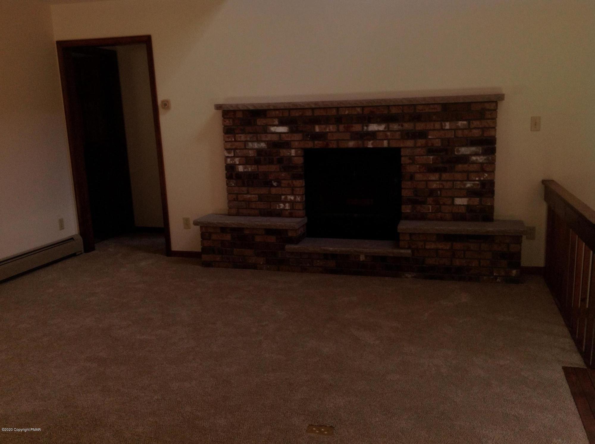 1194 Sugar Mountain Road West Bushkill, PA 18324 - Photo 32 of 41 Main level fire place