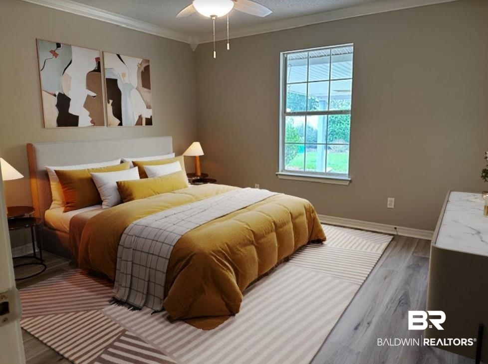 1512 North Cedar Street Foley, AL 36535 - Photo 6 of 13 Bedroom with ceiling fan, hardwood / wood-style flooring, and ornamental molding
